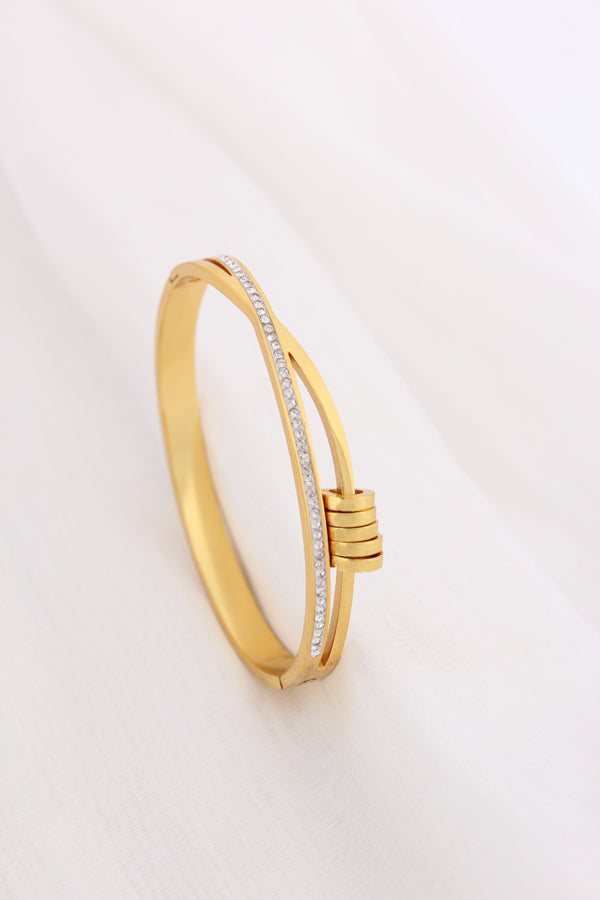 Gold Stainless Steel Bangle With A Twist And Rings (BA032)