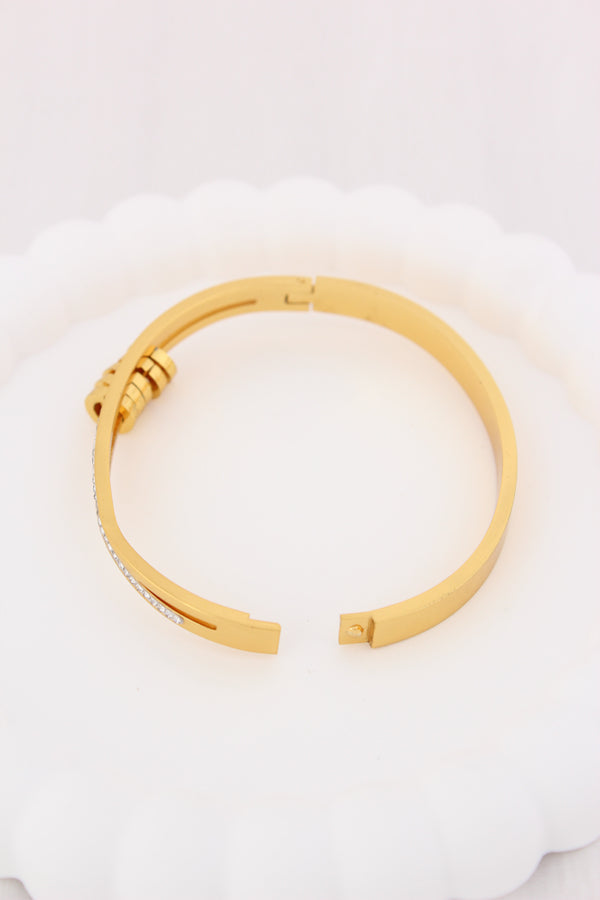 Gold Stainless Steel Bangle With A Twist And Rings (BA032)