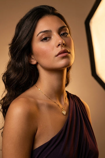 Simple And Elegant Gold Polish Pendant Necklace With White Heart