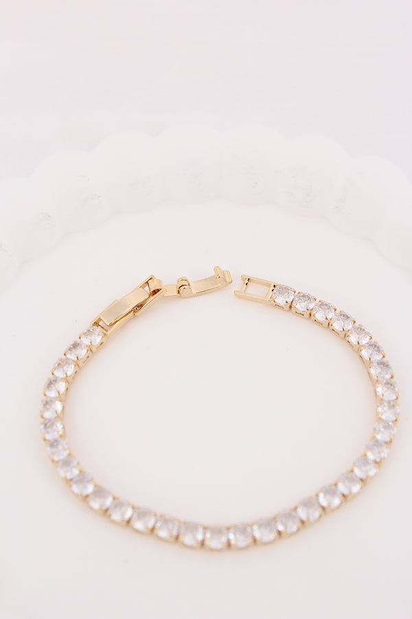 Sleek Tennis Bracelet Design In Gold Polish And Stones (BR028)